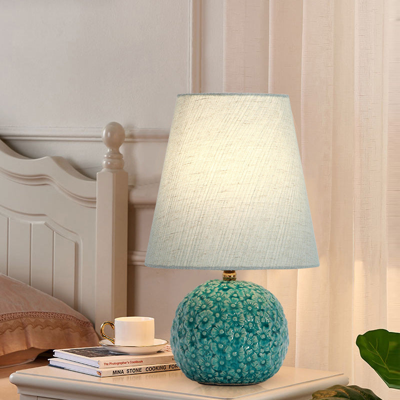 Modern Art Deco Round Carved Base Ceramic Fabric 1-Light Table Lamp For Bedroom