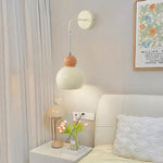 Contemporary Creative Cream Round Dome Iron 1-Light Wall Sconce Lamp For Bedroom