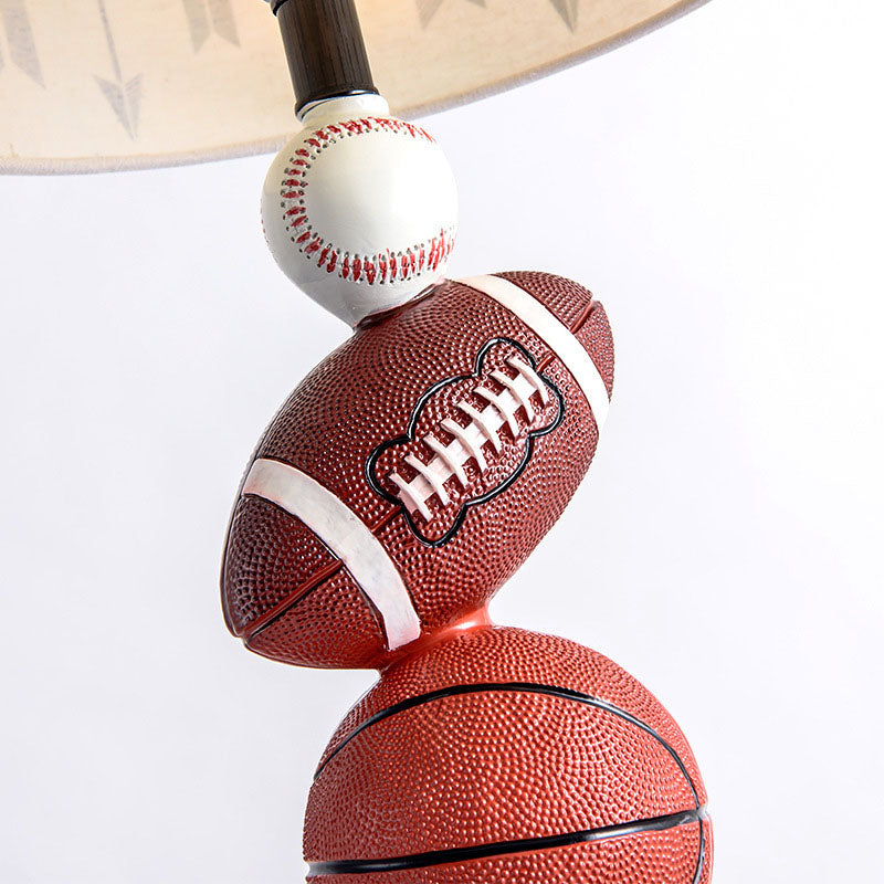 Contemporary Creative Cylinder Basketball Rugby Tennis Fabric Resin 1-Light Table Lamp For Bedroom