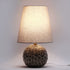 Modern Art Deco Round Carved Base Ceramic Fabric 1-Light Table Lamp For Bedroom