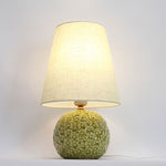 Modern Art Deco Round Carved Base Ceramic Fabric 1-Light Table Lamp For Bedroom